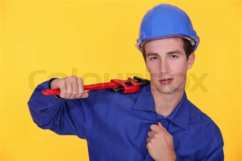 Craftsman Holding A Spanner Stock Image Colourbox