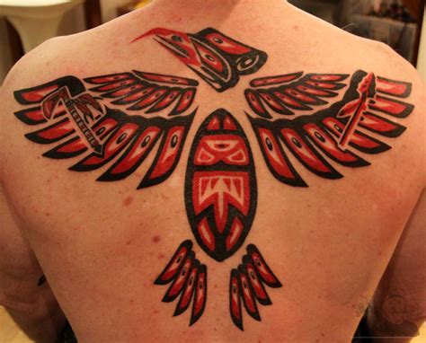 Aztec tribal mexican tattoo on left half sleeve. Aztec style tribal tattoo - Joe Kintz Tattooing