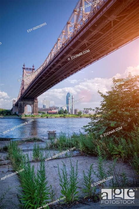 57th Street Bridge In Nyc With Cloudy Blue Sky With Sunshine Stock