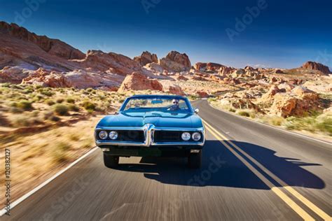 Guy Driving Cool Vintage Car Through Nevada Desert Stock Photo Adobe