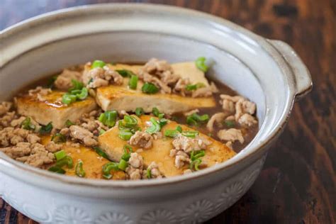 Draining firm and extra firm tofu helps it absorb flavors from a marinade, so this works well with firm and extra firm varieties. Braised Tofu with Ground Pork - Steamy Kitchen Recipes