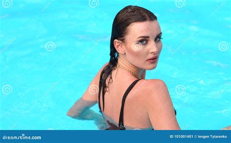 Girl In A Black Bathing Suit Swims In Pool Stock Video Video Of