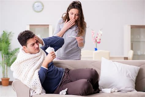 Premium Photo Wife Caring For Sick Husband At Home