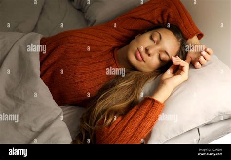 Young Woman Sleeping Peacefully In Bed At Night Stock Photo Alamy