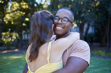 Premium Photo Black Man Interracial Relationship And Hug On Park Lawn
