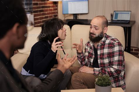 Mad Woman Showing Husband Proof Of Cheating And Adultery Stock Photo By