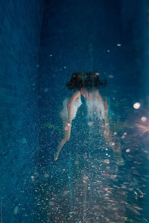 Girl Underwater In A Blue Pool Por Angela Lumsden Stocksy United