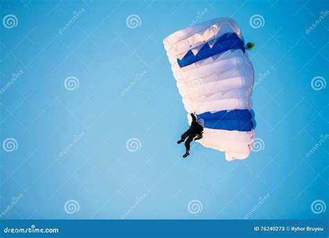 Single Skydiver On Parachute In Blue Clear Sky Active Lifestyle Stock