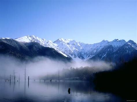 Morning Mist Covers Taisho Ike Lake And Hodaka Mountain