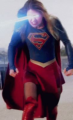 A Woman In A Superman Costume Is Walking
