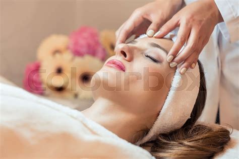 Beautiful Woman Relaxing During Rejuvenating Facial Massage In A Stock Image Colourbox