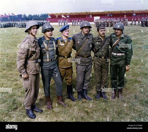 soldiers from the various armed forces of the warsaw pact countries pose for a photo on an