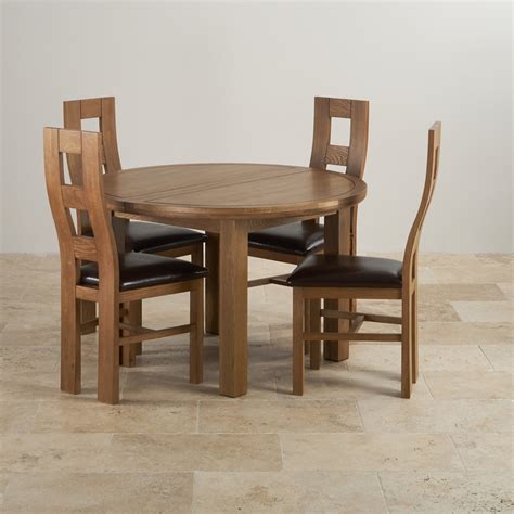 The cosy round table gets an update with the hudson. Knightsbridge Round Extending Dining Table + 4 Leather Chairs