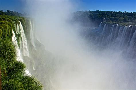 Waterfalls On Both Sides Of The River At Devils Throat In Iguazu Falls