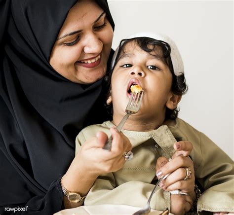Download Premium Image Of Muslim Woman Feeding Her Son 425895 Muslim