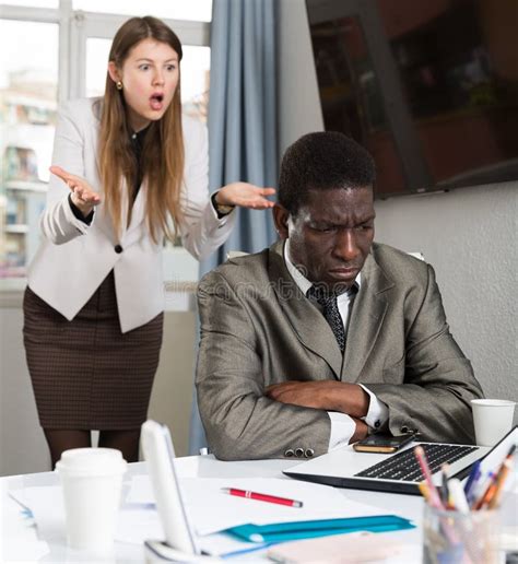 Unhappy Woman Boss Scolding Mistakes In Work To Young Man Manager Stock