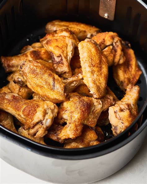 Season wings all over with salt and pepper, and coat the inside of air fryer with nonstick cooking spray. Air Fryer Chicken Wings | Kitchn
