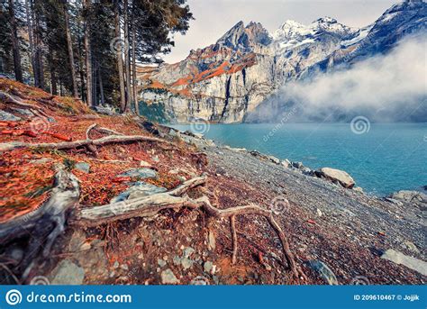 Thick Fog Gloving Mountain Peaks And Lake Captivating Autumn View Of