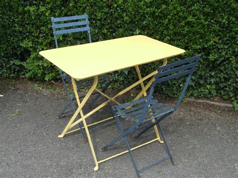 Use a single metal outdoor bench in your garden for a quiet place of reflection, or share a cup of tea with a neighbor in a rocker on your front porch. G183/S - Vintage French Metal Folding Garden / Café / Patio Table - La Belle Étoffe