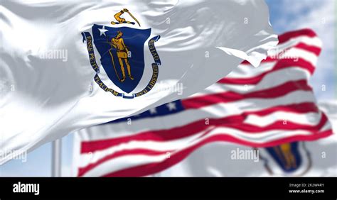 The Massachusetts State Flag Waving Along With The National Flag Of The