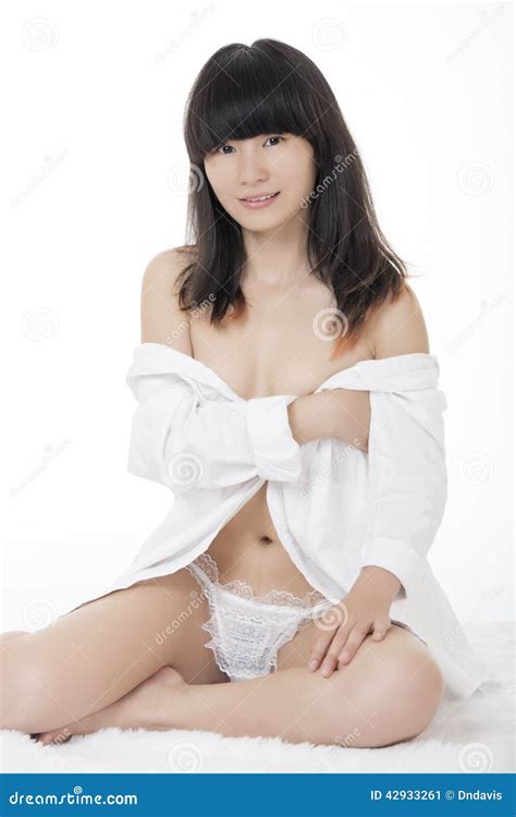 Asian Woman Wearing A White Shirt Isolated On White Backround Stock