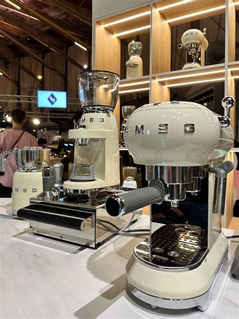 An Espresso Machine Sitting On Top Of A Counter Next To Other Coffee