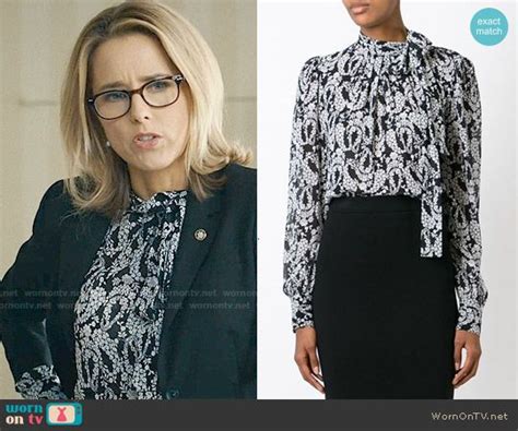 Elizabeth’s Black And White Floral Tie Neck Blouse On Madam Secretary Outfit Details