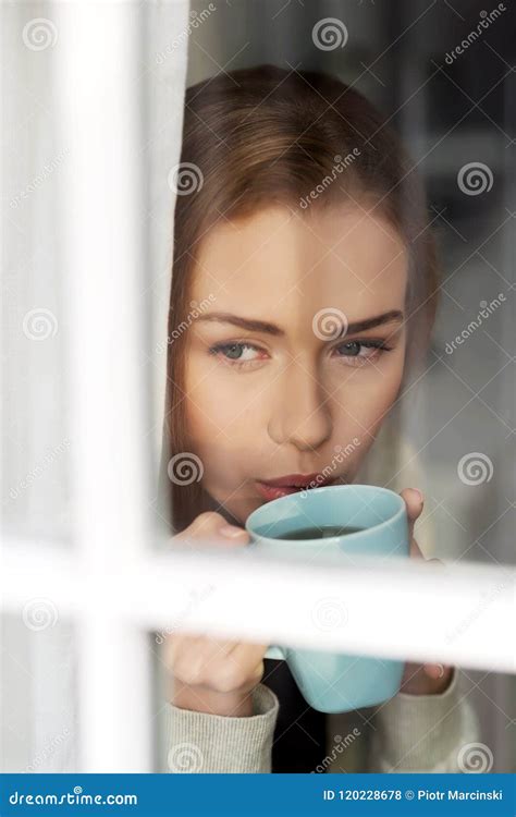 Beautiful Caucasian Woman Drinking Hot Coffee Or Tea And Looking