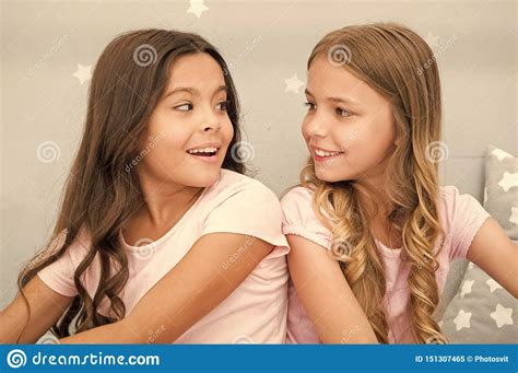 Girls Sisters Spend Pleasant Time Communicate In Bedroom