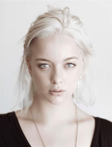 she shares the ancient queen s white blonde hair pale eyes though hers are silverish gray and