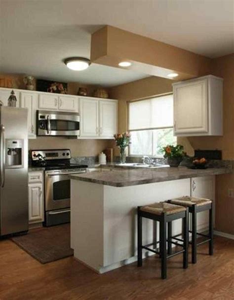 An improved layout and white cabinets and appliances create a pretty and practical design in a compact space. Small Kitchen Design Layout 10x10 - Kitchen Design Ideas ...