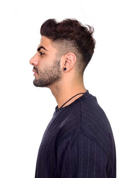 Premium Photo Side View Of Young Handsome Indian Man Isolated Against