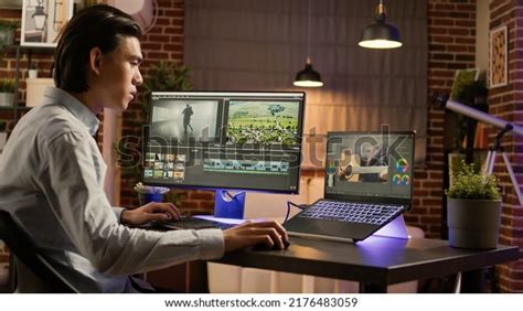 Graphic Designer Working On Editing Footage Stock Photo 2176483059
