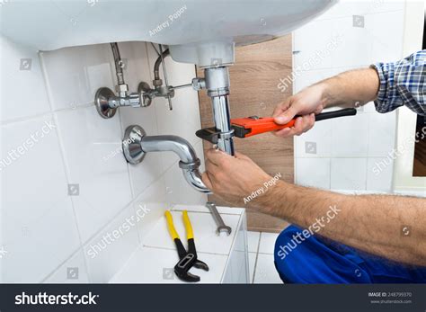 Closeup Male Plumber Fixing Sink Bathroom Stock Photo 248799370