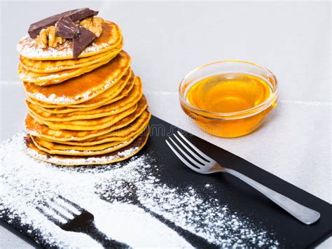 Stack Of Tasty Pancakes Served With Honey Chocolate And Powdered Sugar