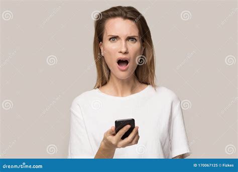 Mad Young Woman Hold Cellphone Frustrated By Phone Malfunction Stock