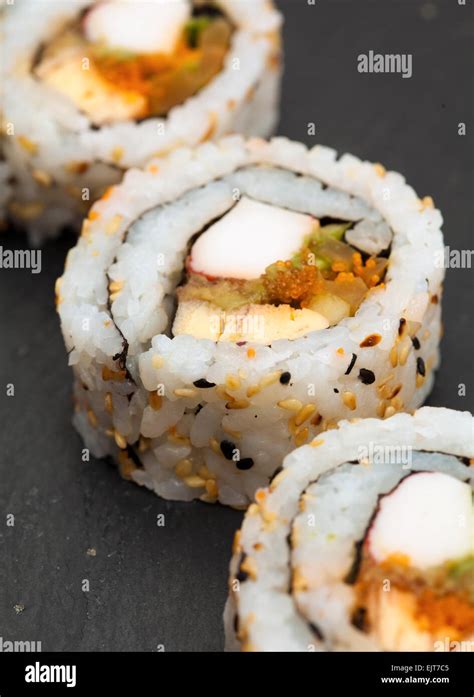 Futomaki Sushi Rolls On A Black Slate Trivet Stock Photo Alamy