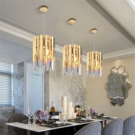 A Dining Room Table With Chairs And Chandelier Hanging From Its Ceiling