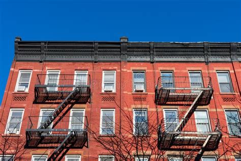 Old Red Brick Buildings In Greenwich Village New York With Fire Escapes