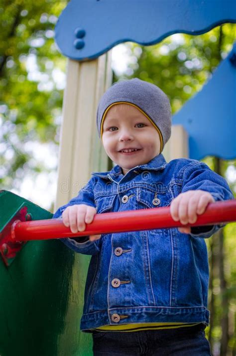 Little Toddler Boy Having Fun At A Playground Stock Photo Image Of