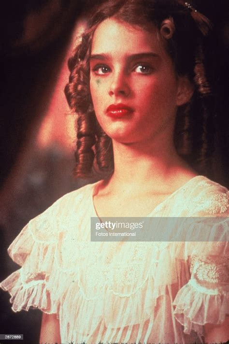 American Actor Brooke Shields Wears A Ruffled Blouse And Heavy Makeup