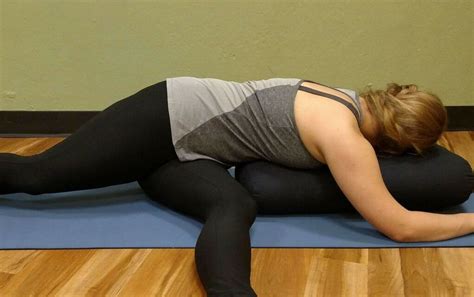 9 Relaxing Yoga Bolster Pillow Poses Journeys Of Yoga Yoga Bolster