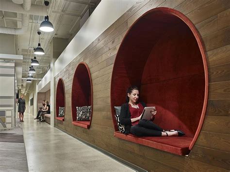 In This Modern Office Three Circular Seating Nooks With Red