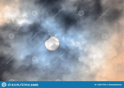 Partial Solar Eclipse In Cloudy Sky Stock Photo Image Of Glow