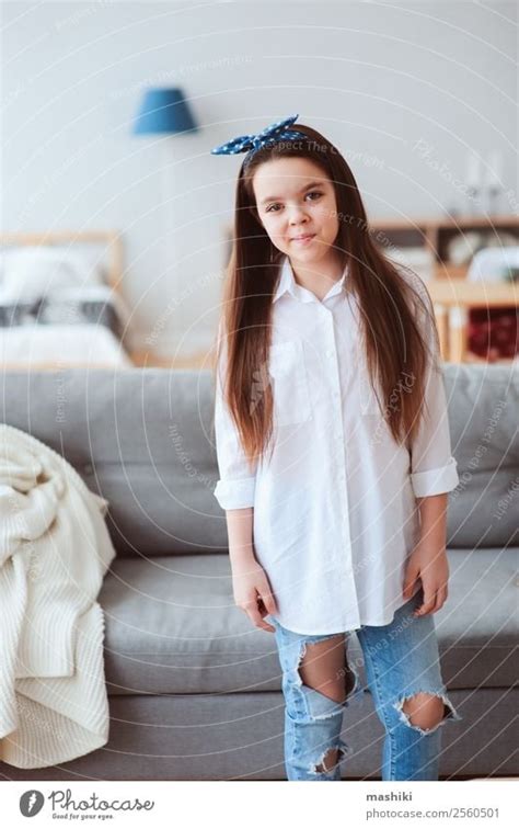 Vertical Portrait Of Happy 10 Years Old Preteen Girl At Home A