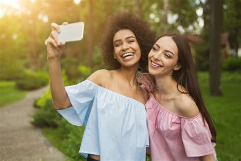 Two Cute Young Women Taking Selfie In Park Stock Image Image Of Girl