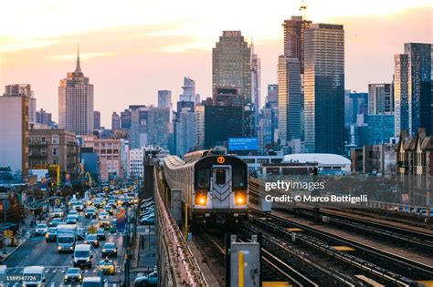 7 Line Subway Train In Queens With Manhattan Skyline New York City High