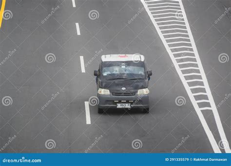 Black Daihatsu Gran Max Pickup Truck Driving Fast On Trans Jawa Highway