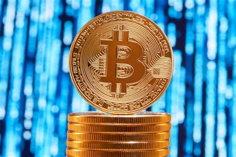 Premium Photo One Bitcoin On Edge Placed On Stack Of Golden Bitcoins