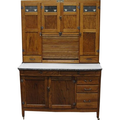 This restored McDougall kitchen cabinet is made of oak. It ...